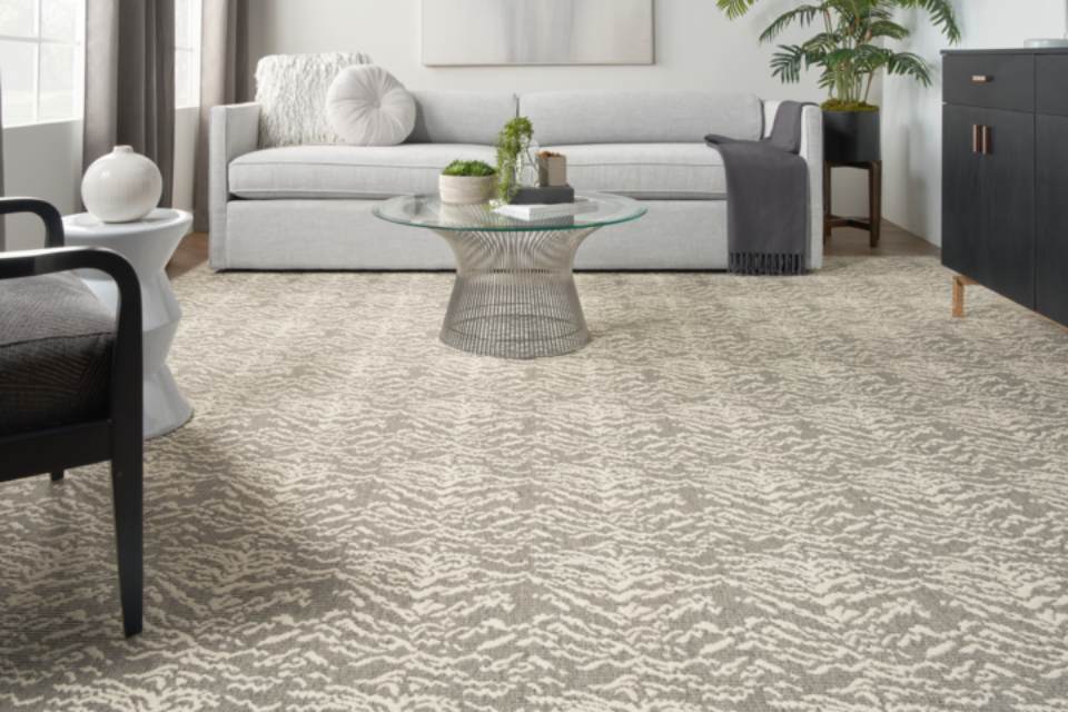 Grey and beige animal print carpet in living room.